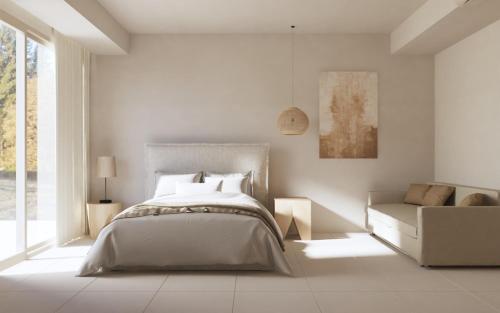 Ένα ή περισσότερα κρεβάτια σε δωμάτιο στο Haus Platanos Apartments & Bungalows by the Sea