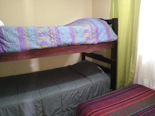 a couple of bunk beds in a room at Cabañas doña carmen in Punta de Choros