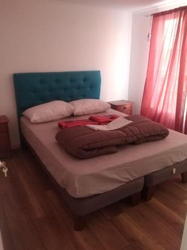 Ένα ή περισσότερα κρεβάτια σε δωμάτιο στο cabañas de la casona