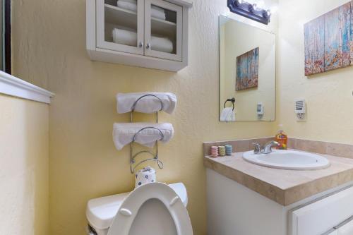 a bathroom with a toilet and a sink at Stateline Serenity in Stateline