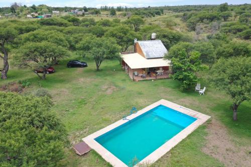 A view of the pool at Cabaña Los Puquios or nearby