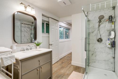 a bathroom with a sink and a shower at Redmond Retreat Steps to Lake and Idylwood Park! in Redmond