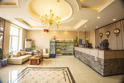 Uma área de estar em Harbin Binpeng Inn - Harbin Taiping International Airport