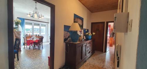 a hallway with a dining room and a living room at IL CENTRALE GUEST HOUSE NEW in Nuoro
