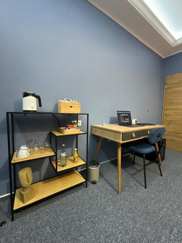 a room with a ping pong table and a desk at Hotel Residenz Luxury - Outletcity - Parken - Klima - 24h Check-In in Metzingen