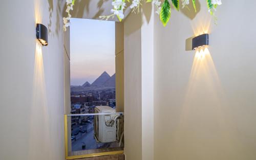 a room with a mirror and a view of a city at Piccolo Mondo Boutique Hotel in Cairo