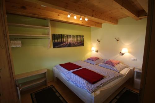 a small bedroom with a bed with two pillows at Kasimir Hof in Seebach