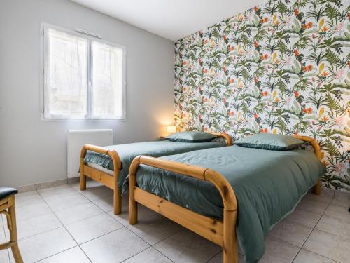 Posteľ alebo postele v izbe v ubytovaní Maison Calme avec Jardin Clos, Près de Pornic et Nantes, Wifi et Équipements Bébé Inclus - FR-1-306-1239