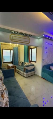 a large living room with a couch and a bed at Sea View Studio alexandria in Alexandria