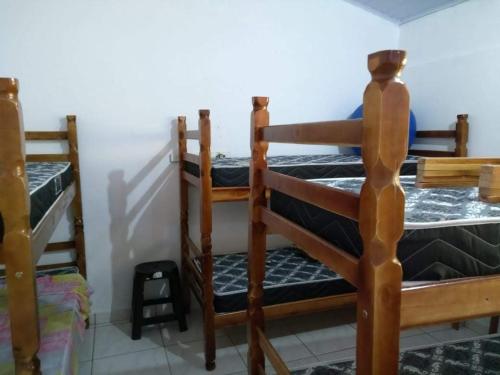 Ένα ή περισσότερα κρεβάτια σε δωμάτιο στο Chacara Branca de Neve
