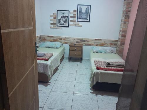 Кровать или кровати в номере Meu Quarto no Rio de Janeiro
