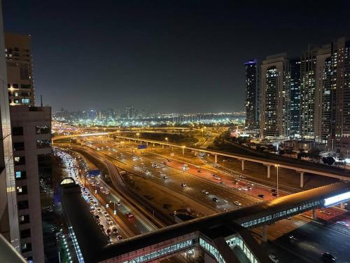 a view of a busy city street at night at Full Marina View 2BR Luxury Apartment in Dubai