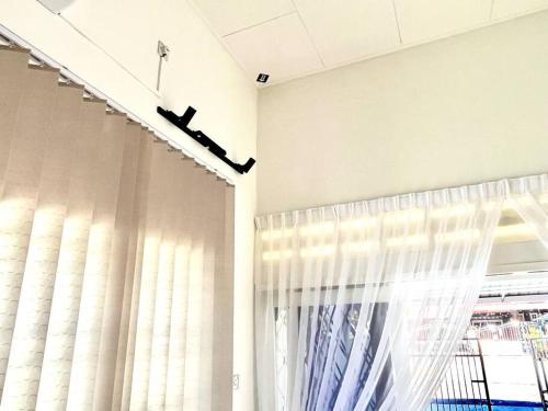 a room with a large window with curtains at Gioia2Home 5 mins to Taiping/Kamunting in Taiping