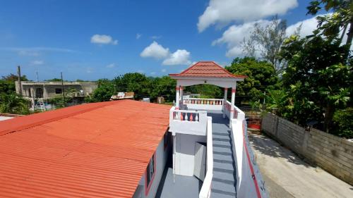 a house with a gazebo on the roof at Holiday rooms in St Thomas Jamaica in Clifton