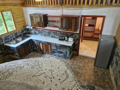 a kitchen with a sink and a counter top at Mai Pen Rai Bungalows in Than Sadet Beach