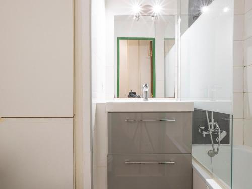 a bathroom with a sink and a mirror at Studio Avoriaz, 1 pièce, 4 personnes - FR-1-314-270 in Morzine