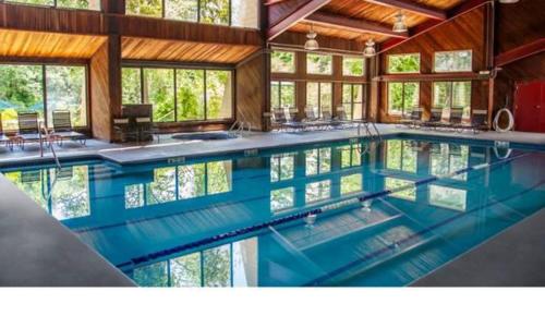 a large swimming pool in a house at L&R in Torrington