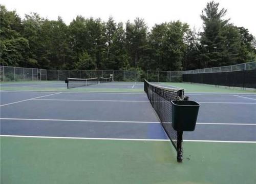 a tennis net sitting on a tennis court at L&R in Torrington