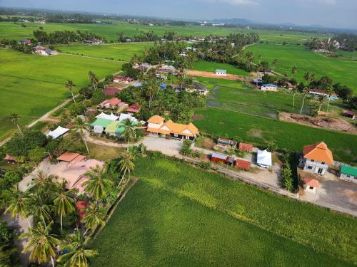 an aerial view of a small village with houses at HOMESTAY Kampong KOTA AUR Resort with swimming pool, Kepala Batas, SEBERANG PERAI, PENANG -MOTAC registered Awarded ASEAN homestay standard Malaysia AWARD 2023-2028 Only 3 minutes from viral KG AGONG in Kepala Batas