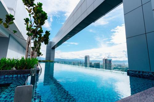 a swimming pool on the roof of a building at Royce KLCC Kuala Lumpur City Centre by Dormeo Destinations in Kuala Lumpur