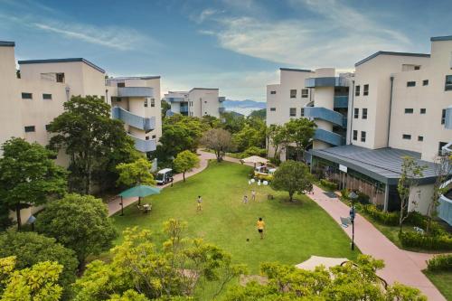 an aerial view of a park between buildings at Ananti at Namhae in Namhae