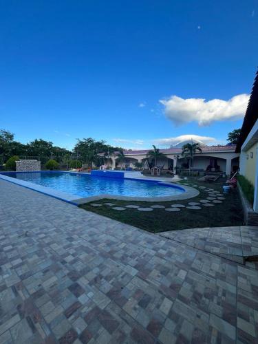 a large swimming pool in a yard at Hotel Campestre Bella Vista Ometepe in Moyogalpa