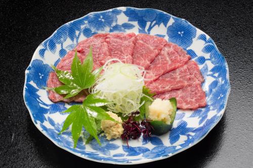 a blue and white plate of food with meat and vegetables at Beautiful Japanese Garden Kagetsu in Fuefuki