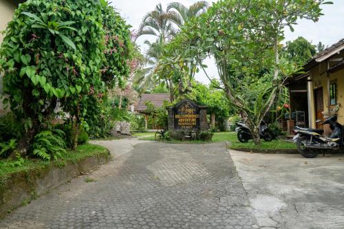 a street with a sign in front of a building at Bali Village Villa in Perean