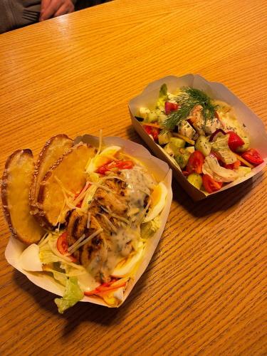 a table with two plates of food on a table at Birlik in Tengiz