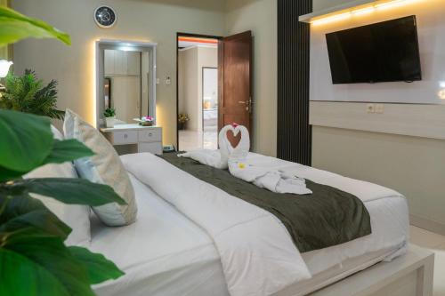 Кровать или кровати в номере Bali Village Villa