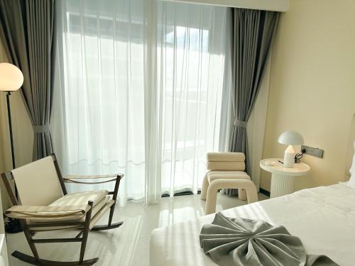 Ένα ή περισσότερα κρεβάτια σε δωμάτιο στο Ark Seaview Holiday Inn