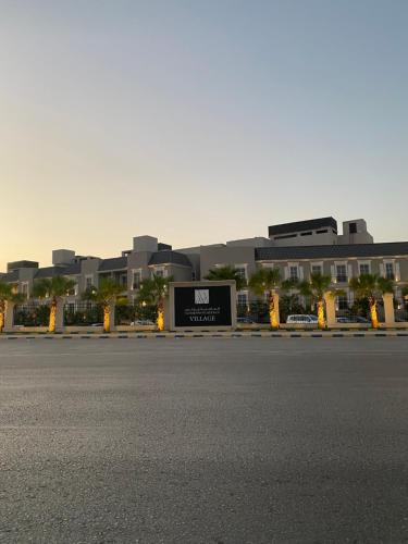 an empty street in front of a large building at Elegant 3BD Condo near Boulevard in Riyadh