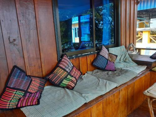Tempat tidur dalam kamar di Bong's Guesthouse M'Pai Bay