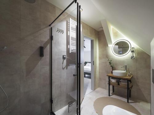 a bathroom with a shower and a sink at Craft Inn - Boutique Hotel in Sibiu