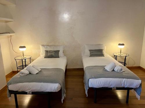 Un ou plusieurs lits dans un hébergement de l'établissement Il Campanile