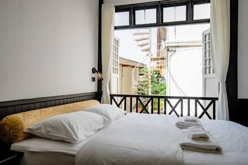 Un pat sau paturi într-o cameră la Haheng House