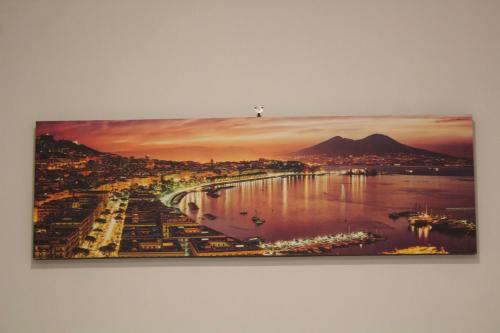 a painting on a wall of a city at VesuvioSerenityRoom in Ercolano