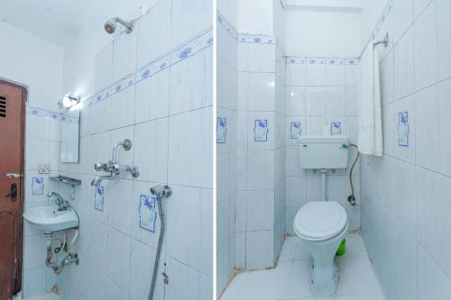 a bathroom with a toilet and a sink at OYO 801 Hotel View Global in Kathmandu