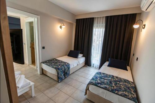 Letto o letti in una camera di MIR'AMOR GARDEN Resort Hotel-ALL INCLUSIVE
