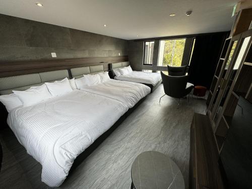 Кровать или кровати в номере プラフィーノリゾートヴィラ