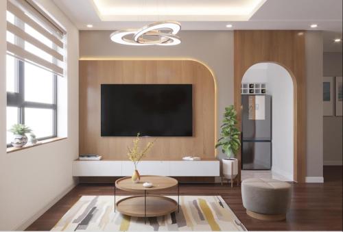 sala de estar con TV de pantalla plana en la pared en Bach Dang Apartment Hai Duong, en Hải Dương