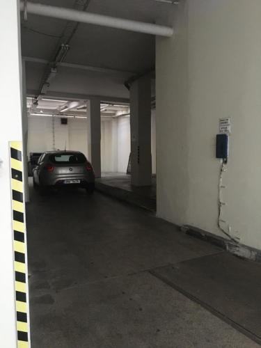 a parking garage with a car parked in it at Hotel PurPur in Prague