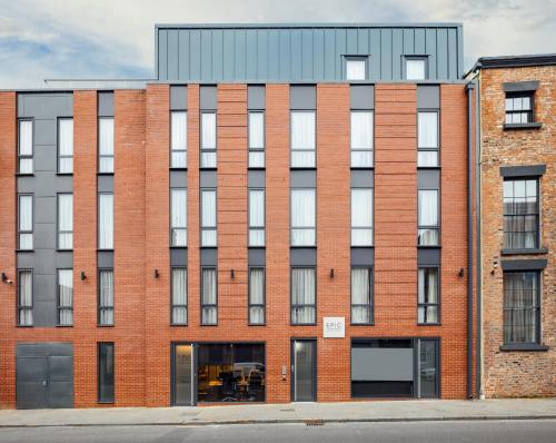 an exterior view of a brick building at EPIC Apart Hotel - Tunnage Square in Liverpool