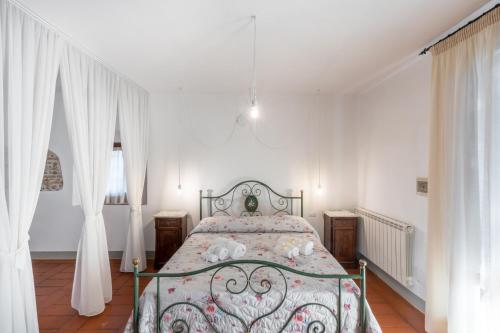 Postel nebo postele na pokoji v ubytování Agriturismo Poggio Nardini