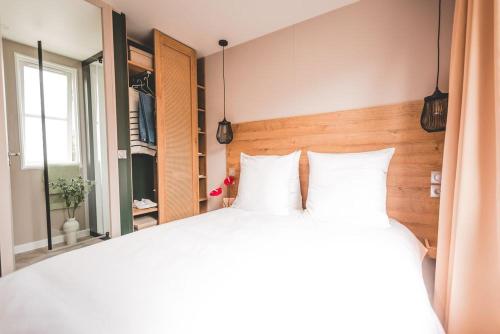 Cama o camas de una habitación en Verblijfpark Tulderheyde
