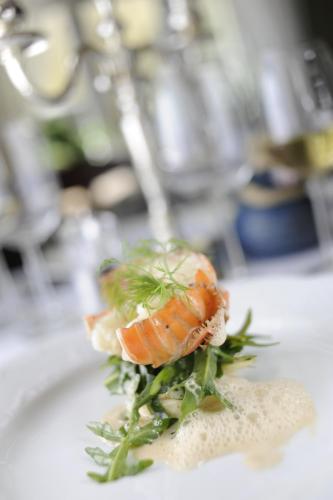 a shrimp on a white plate on a table at Walaker Hotel in Solvorn