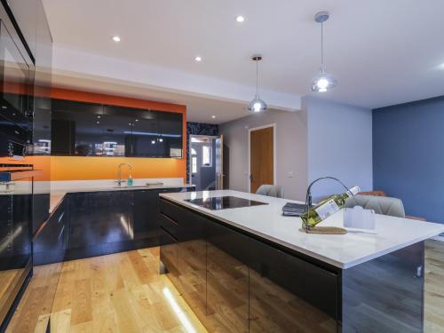 a kitchen with a sink and a counter top at Magnolia House in Reading