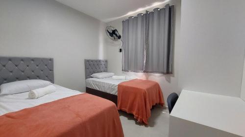 Postel nebo postele na pokoji v ubytování Apê confortável no Cond. Jardim dos Coqueiros