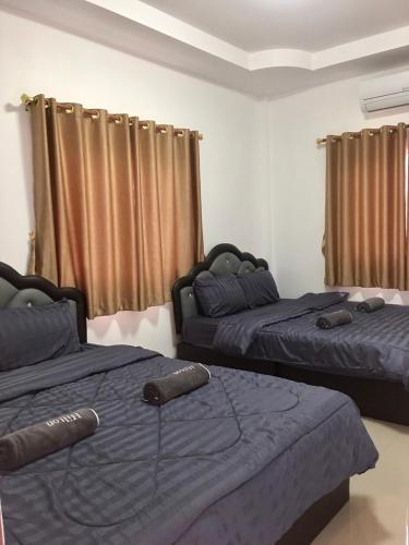 Postel nebo postele na pokoji v ubytování Irada resort smaesarn ไอรดา รีสอร์ท แสมสาร