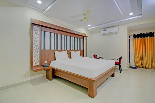 Voodi või voodid majutusasutuse Super OYO Flagship 80823 Hotel Sitara Grand toas